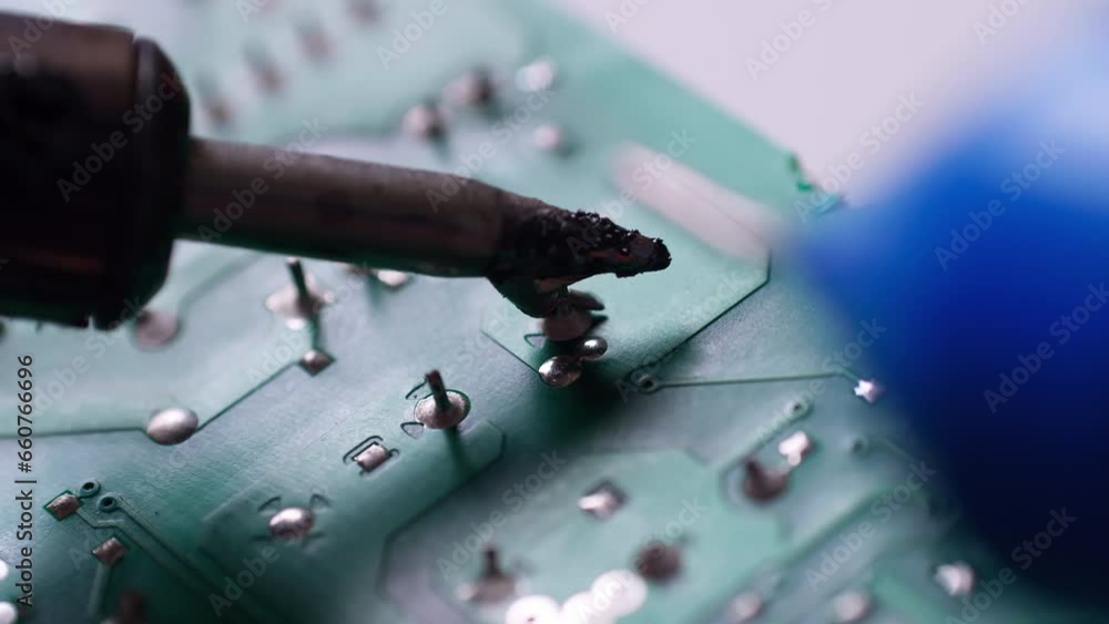 Poster the engineer replaced the ic transistor with a soldering iron on the electrical circuit pcb board to