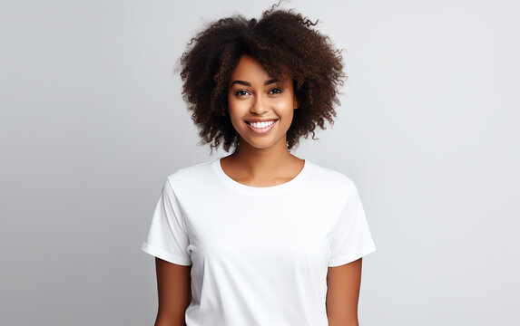 Portrait of young beautiful black african american dark-skinned woman cheerfuly smiling looking at camera. Girl with afro curly hair isolated on white background