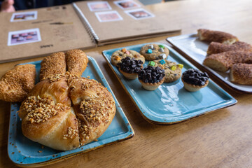 Bread and bakery on wood table in coffee shop