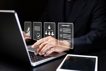 Businessman using computer for Document Management System (DMS) and online documentation database, paperless office concept