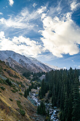 Obraz premium golden autumn at the foot of snowy mountains