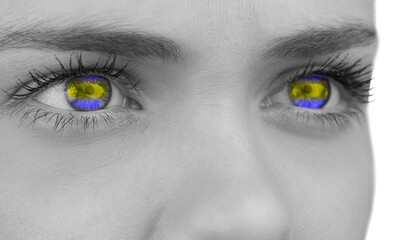 Digital png photo of woman's eyes in ukraine flag colours on transparent background