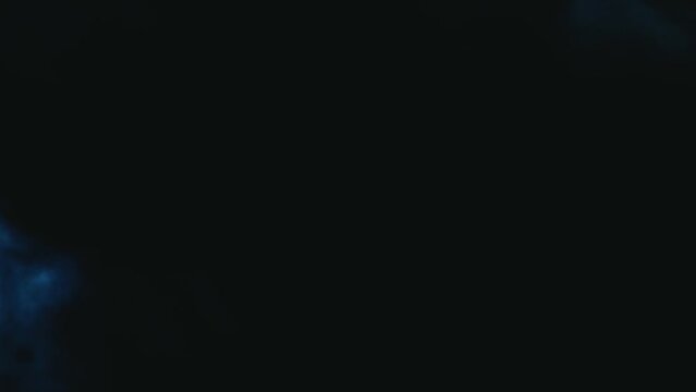 Cloud movement and the full moon in the night sky. Clouds moving past the bright moon. Close up. Time lapse. A mysterious and dark scene from a werewolf horror film