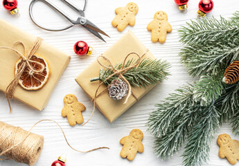 Christmas gifts, gingerbread cookies, decorations with christmas tree.