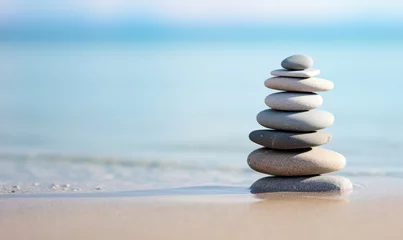Deurstickers Stenen in het zand zen stones stack balancing on the beach
