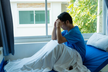 Male patient resting on a hospital bed Depression is related to being absent-minded. Anxiety and stress From the only Asian patient in a hospital bed.