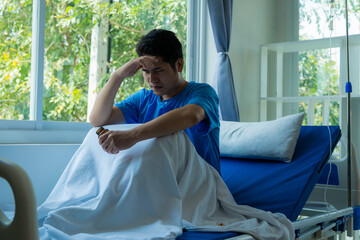 Male patient resting on a hospital bed Depression is related to being absent-minded. Anxiety and stress From the only Asian patient in a hospital bed.