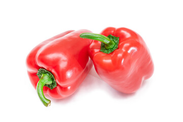 Two Fresh Red Sweet Bell Peppers Isolated on White Background