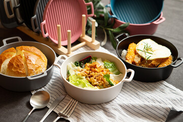 Salad, bread and various foods on the table	