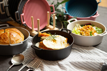 Salad, bread and various foods on the table	