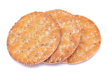 A Heap of Round Salt Crackers with Sesame Isolated on White Background. Dry Snacks - Isolation