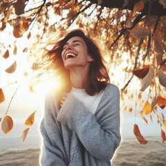 Woman laughing in autumn park
