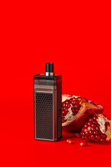 Electronic cigarette with pomegranate flavor on red background