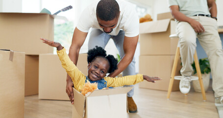 Father, playing and child in a box while moving house with a black family together in a living...