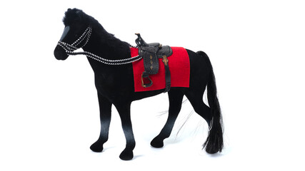 Black plastic toy horse isolated on the white background 