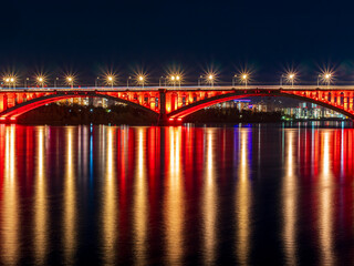 Fototapeta na wymiar City bridge. The night view of a cityscape