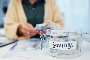 Woman, jar and savings for money, investment or growth in finance, profit or expenses on desk at...