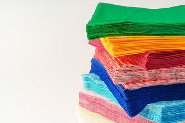 Colorful stack of paper napkins on white background
