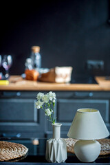 kitchen with lmap and vase
