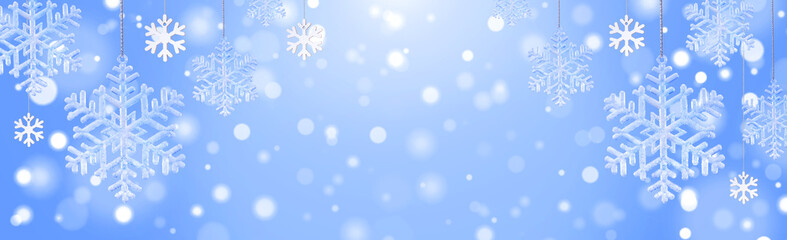 Christmas composition of snowflakes on a blue background with space for text
