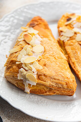sweet almond triangle cake cream puff pastry dessert eating cooking appetizer meal food snack on the table copy space food background rustic top view