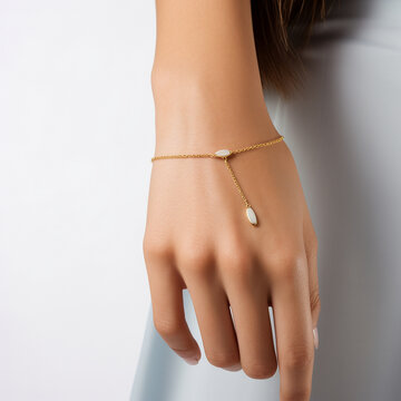 A hand model wearing a minimal gold bracelet - Generative AI
