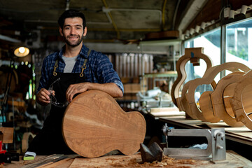 Acoustic Guitar Luthier Smiling in Workshop Portrait