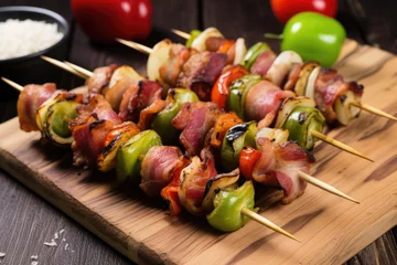 Poster skewers with brussels sprouts wrapped in bacon placed on board © Alfazet Chronicles