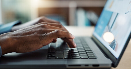 Hands typing, laptop keyboard and closeup at desk, web design and planning for user experience on...
