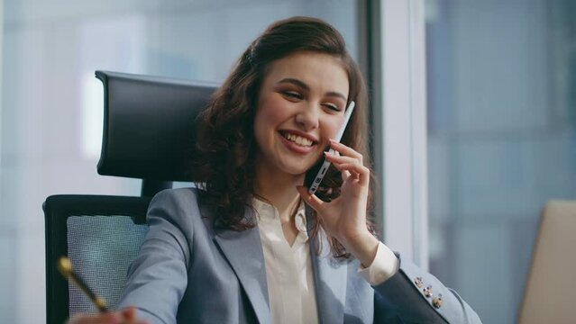 Successful girl entrepreneur calling telephone sitting luxury office close up.