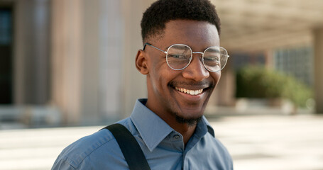 Business, face and happy black man with glasses in a city for travel, commute or outdoor morning...