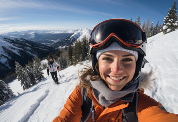 Fototapeta na wymiar Selfie of a young 22s year old northern European woman with ski goggles in ski clothing and helmet skiing content and happy on top of snowy mountain 
