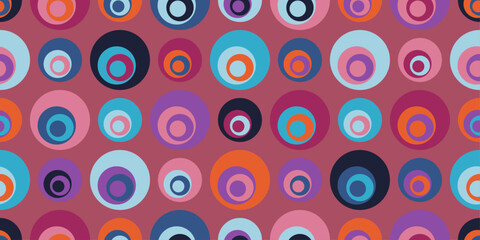 Colored circles with more circles inside them. Vector pattern of circles, with circles inside. Mostly pink colors.