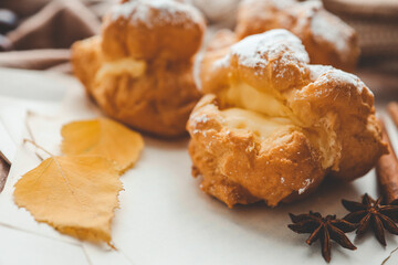 Freshly baked choux pastries close up