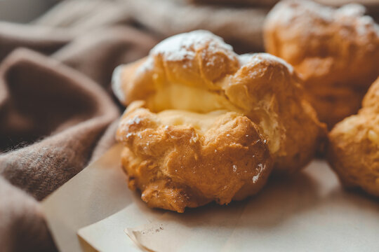 Freshly baked choux pastries close up