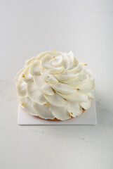 Fine French dessert and cakes on bright and white background. Petite Gateau and Entremet cakes. Well decorated celebration cakes. 