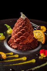 Christmas cone chocolate dessert with sauce