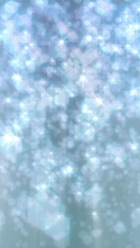 Celebration or Christmas background loop. Defocused snow or glitter. Silver sparkly hexagons. Vertical video.