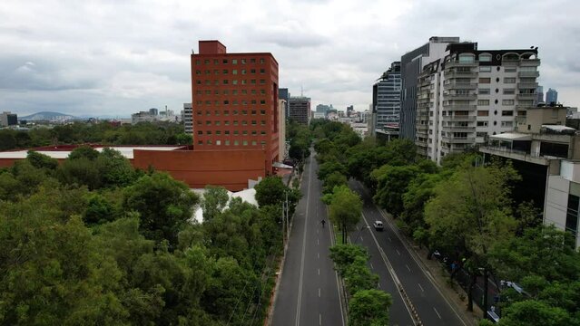backwards drone shot of totally empty streets in mexico city in polanco