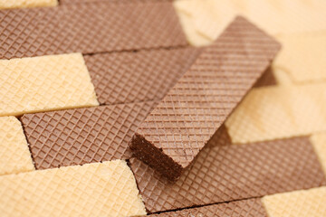 Stacked delicious chocolate wafers in large amount. Two different flavours of classic waffles