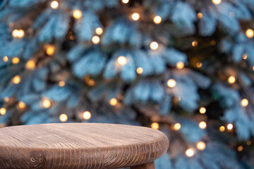 Christmas background with wooden scene and defocused holiday tree lights