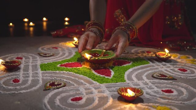 Clay diya lamps lit during diwali celebration, Diwali, or Deepavali, is India's biggest and most important holiday.