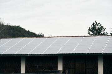 Sustainable Modern House with Solar Panels. A Beautiful Blend of Style and Renewable Energy. Sustainable home powered by solar panels.