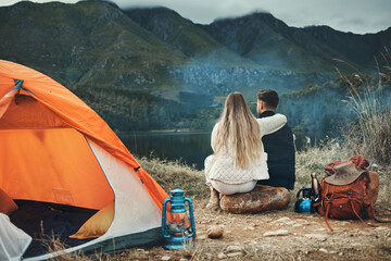 Couple, hug and relax on mountain camping, adventure or travel in nature and environment. People,...