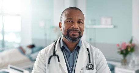 Fotobehang Healthcare, doctor and black man with arms crossed at hospital with smile for support, service and wellness. Medicine, professional and African expert with happiness and pride for career or surgery © N F/peopleimages.com