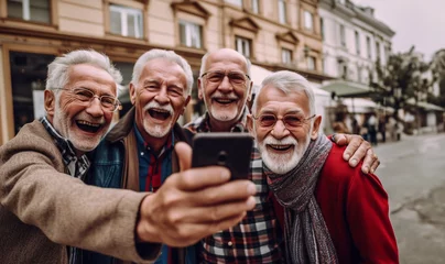 Foto op Canvas group of people senior adults having fun celebrating together outdoor. taking picture selfie with phone technology smiling and laughing with joy. © annebel146
