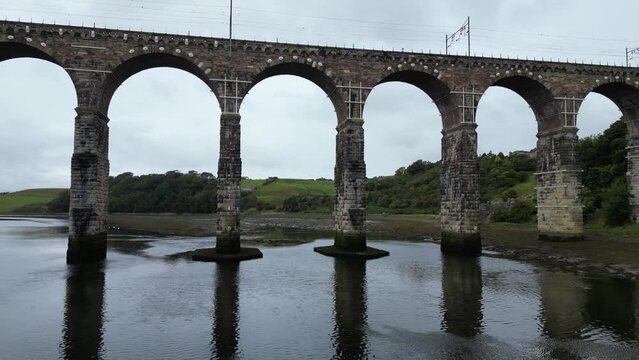 Drone flying over the River Tweed between the arch of Royal Border Bridge in Northumberland, England