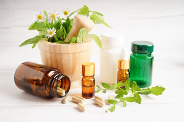 Alternative medicine herbal organic capsule with vitamin E omega 3 fish oil, mineral, drug with herbs leaf natural supplements for healthy good life.