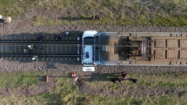 A passenger car collided with a train. The car was involved in an accident at a railway crossing. accident