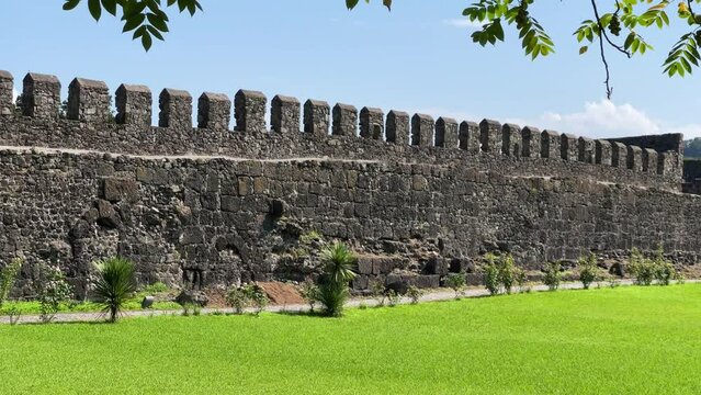 One of the ancient walls of historical Gonio Fortress on a sunny day in Adjara, Georgia